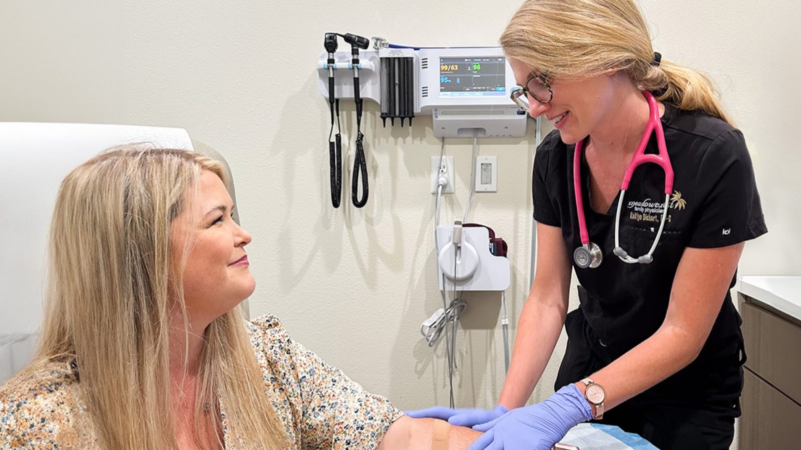Kaitlyn Dickert, PA-C performing an examination on a patient
